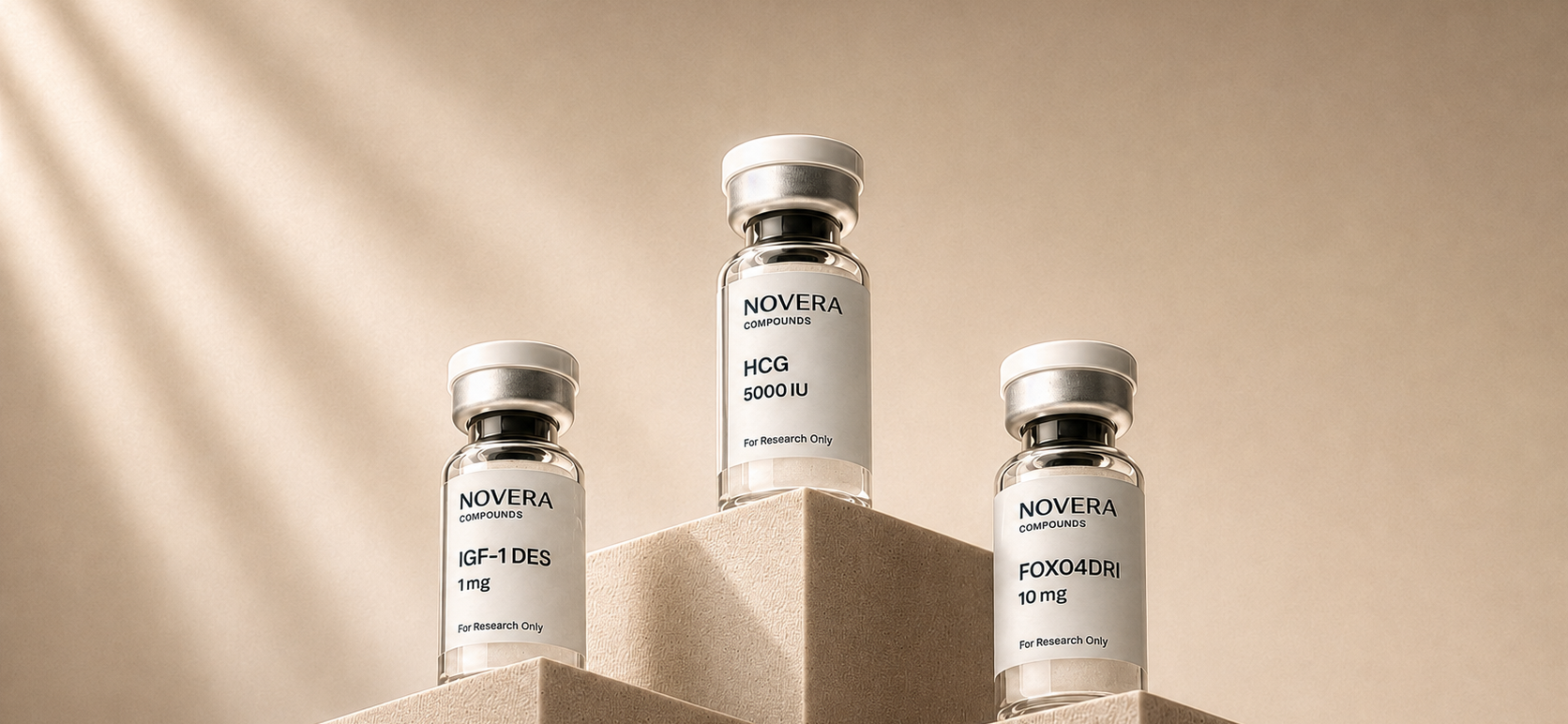 Novera IGF-1 DES, HCG, and FOXO4-DRI research peptide vials on stone pedestals